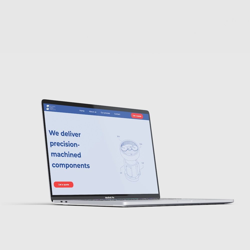 Custom industrial website shown on a laptop